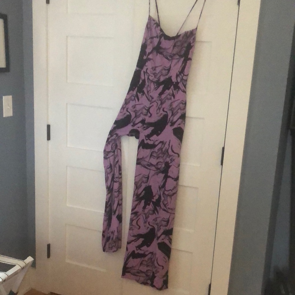 Great flowing jumpsuit. Adjustable tie in the back. Never worn, brand new.